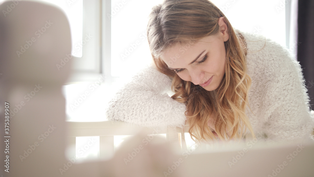 Beauty mother looking on baby sleeping girl. Sweet motherhood Beauty mother looking on baby sleeping girl. Sweet motherhood