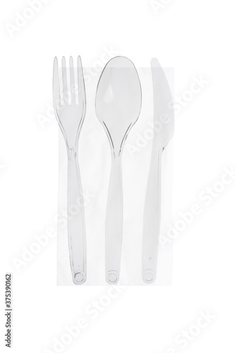 Tris di posate cristal trasparenti monouso su tovagliolo - forchetta  cucchiaio  coltello - fotografate su sfondo bianco