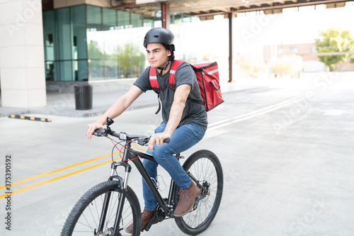 Young Man Out For Courier Delivery On Bicycle