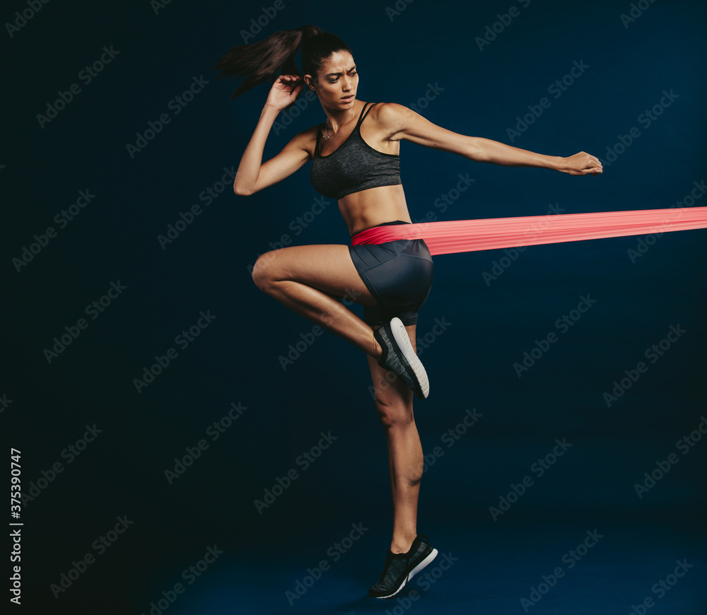 Healthy woman working out with resistance band Healthy woman working out with resistance band