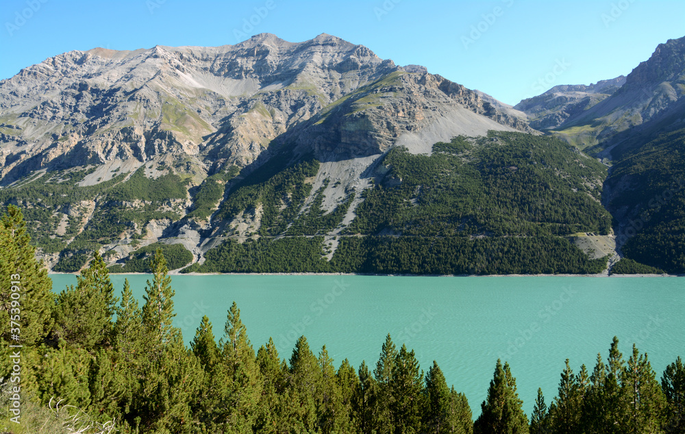 Obraz premium Lake Cancano is an artificial water basin adjacent to Lake San Giacomo in the Fraele valley in the municipality of Valdidentro near Bormio.