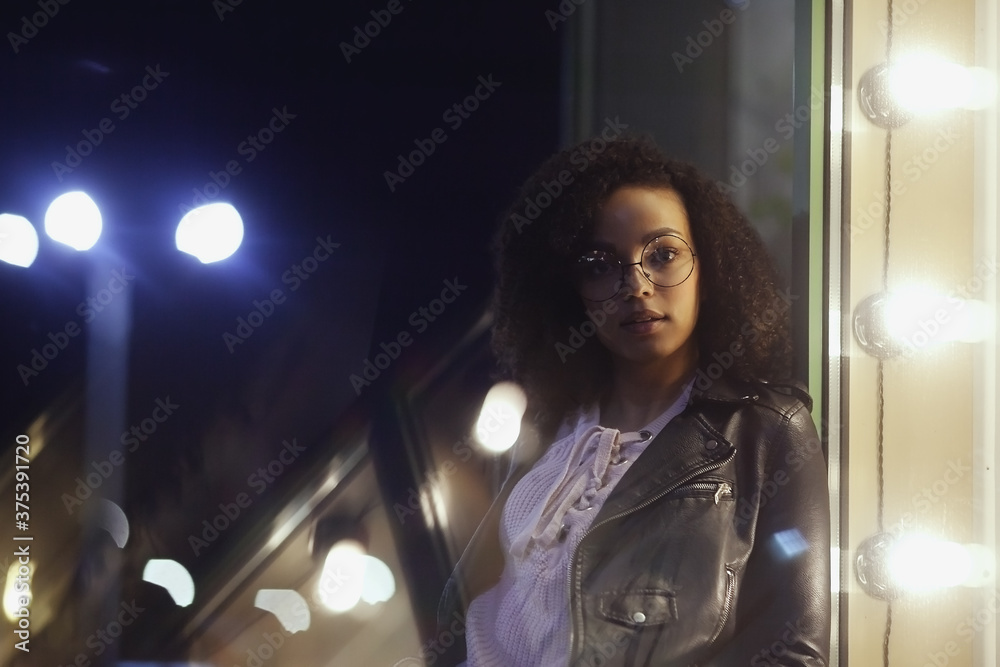 Fashionable woman on urban city street at night Fashionable woman on urban city street at night