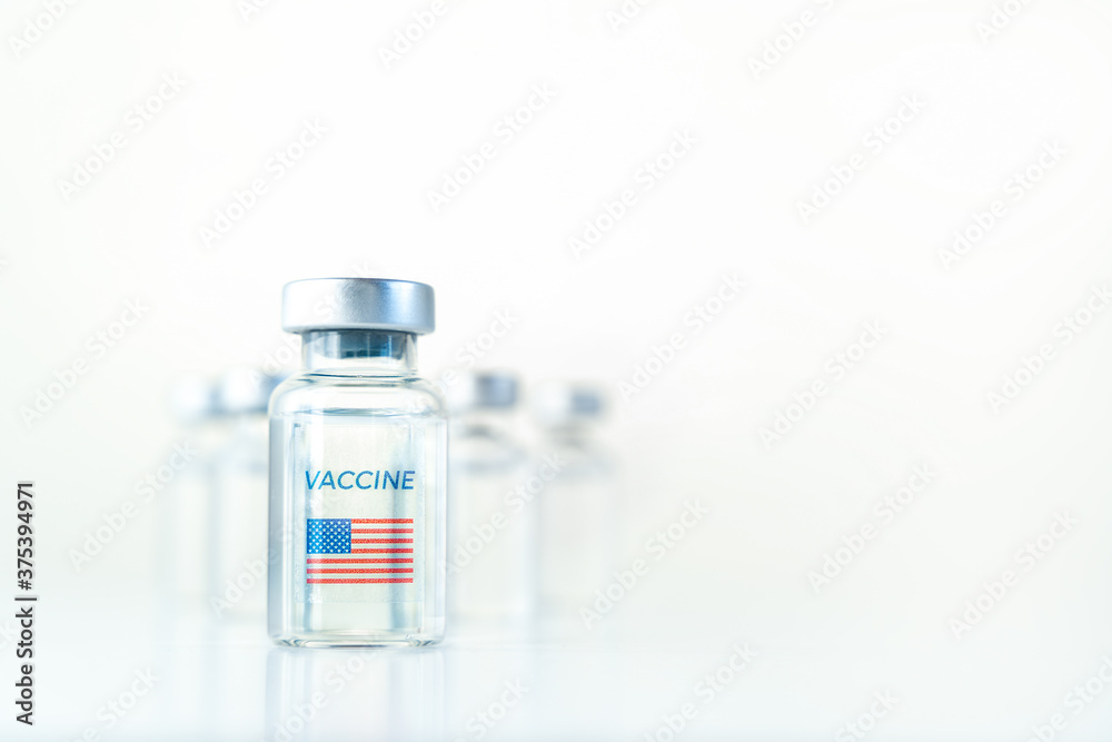 Transparent vials with USA flag. Vaccine for covid-19 coronavirus, flu, infectious diseases. Injection after clinical trials for vaccination of human, child, adult, senior. Medicine, drug concept Transparent vials with USA flag. Vaccine for covid-19 coronavirus, flu, infectious diseases. Injection after clinical trials for vaccination of human, child, adult, senior. Medicine, drug concept