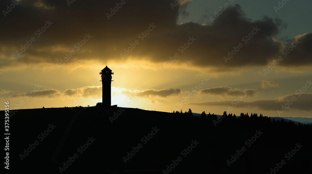 silhouette of the Feldberg tower with the traditional bacon museum while sunset