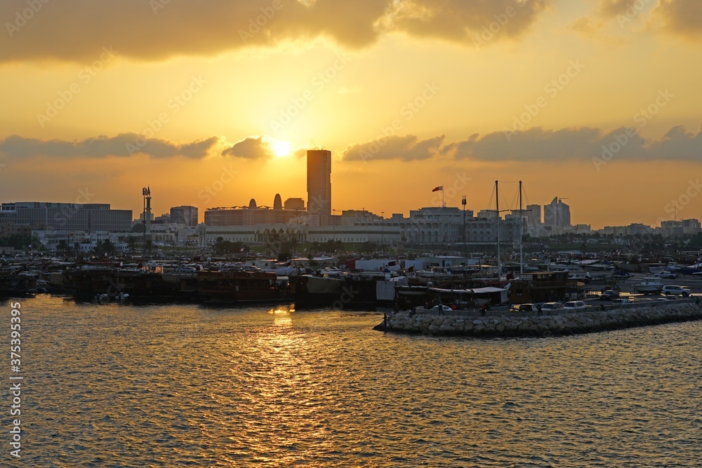 Sunset view of the bay and the old skyline in Doha, Qatar