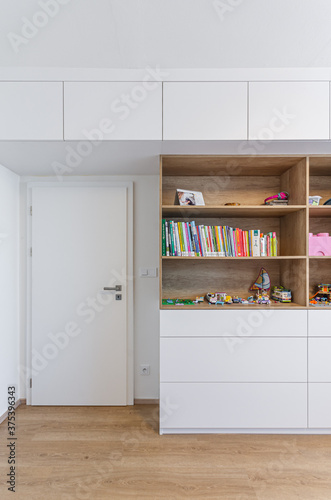 Cabinet shelf wardrobe in Children's room with toys and books
