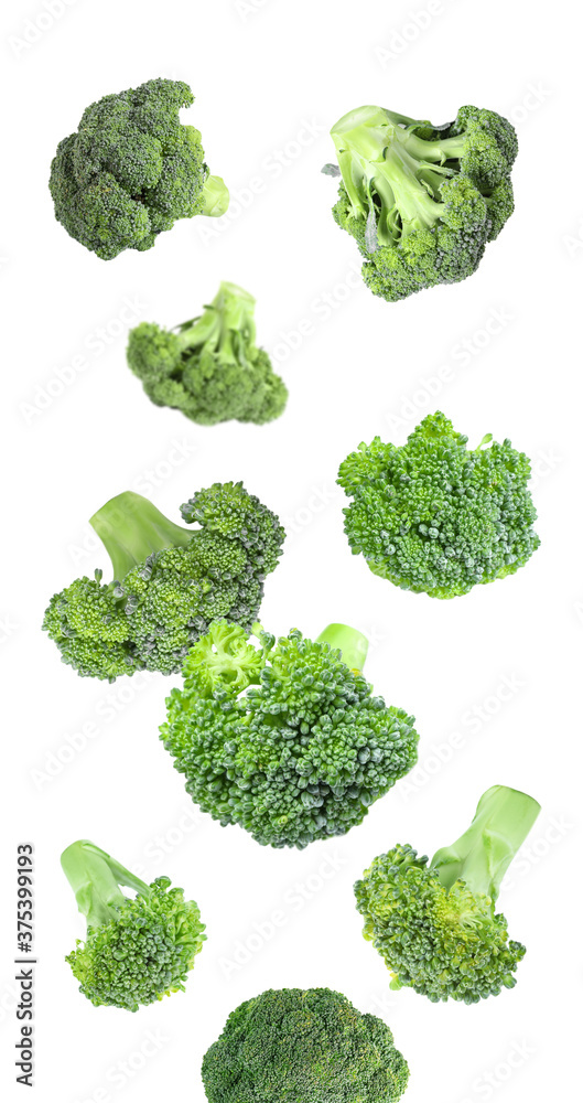 Fresh green broccoli falling on white background Fresh green broccoli falling on white background