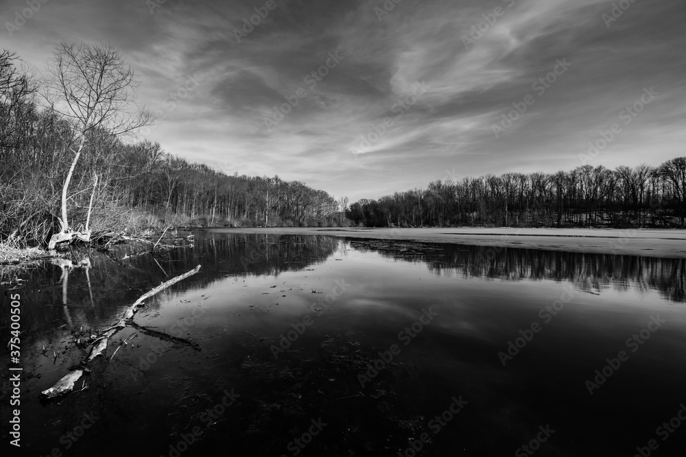 Winter lake sunsets in black and white.