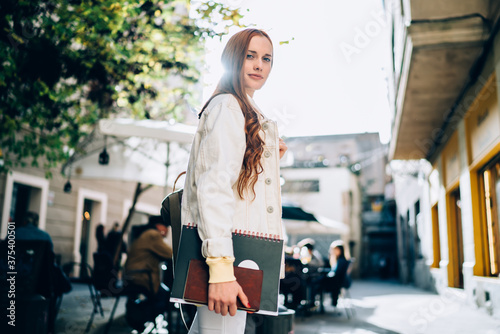 Canvas Print Confident female student on city street
