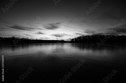 Winter lake sunsets in black and white.
