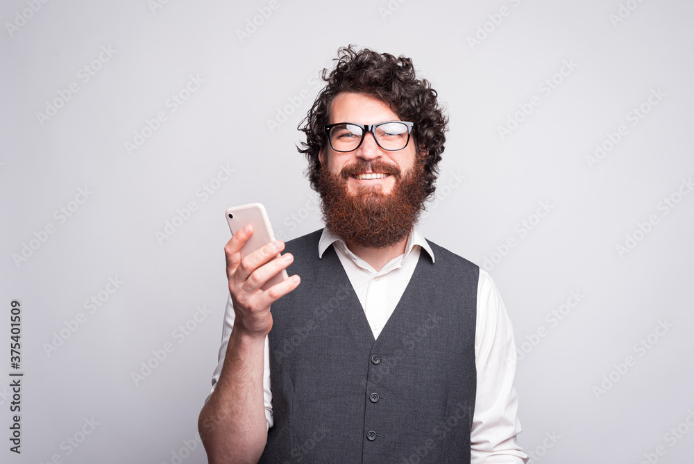 Portrait of joyful man with beard wearing eyeglasses and looking Portrait of joyful man with beard wearing eyeglasses and looking