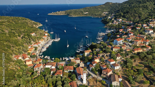 Aerial drone photo of picturesque beautiful seaside village of Kioni a safe anchorage for yachts and sail boats, a true gem of Ithaki or Ithaca island, Ionian, Greece