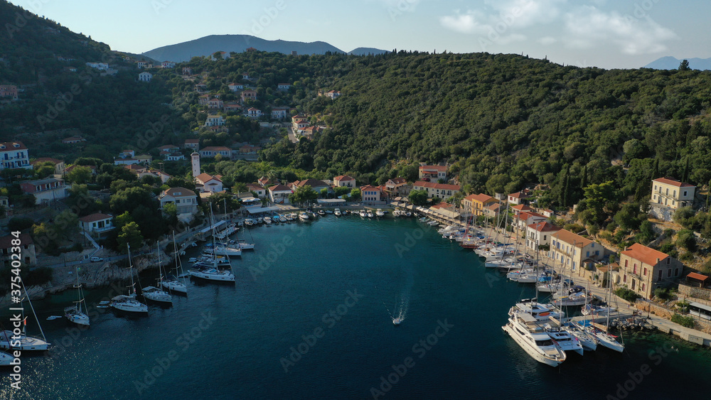 Aerial drone photo of picturesque beautiful seaside village of Kioni a safe anchorage for yachts and sail boats, a true gem of Ithaki or Ithaca island, Ionian, Greece