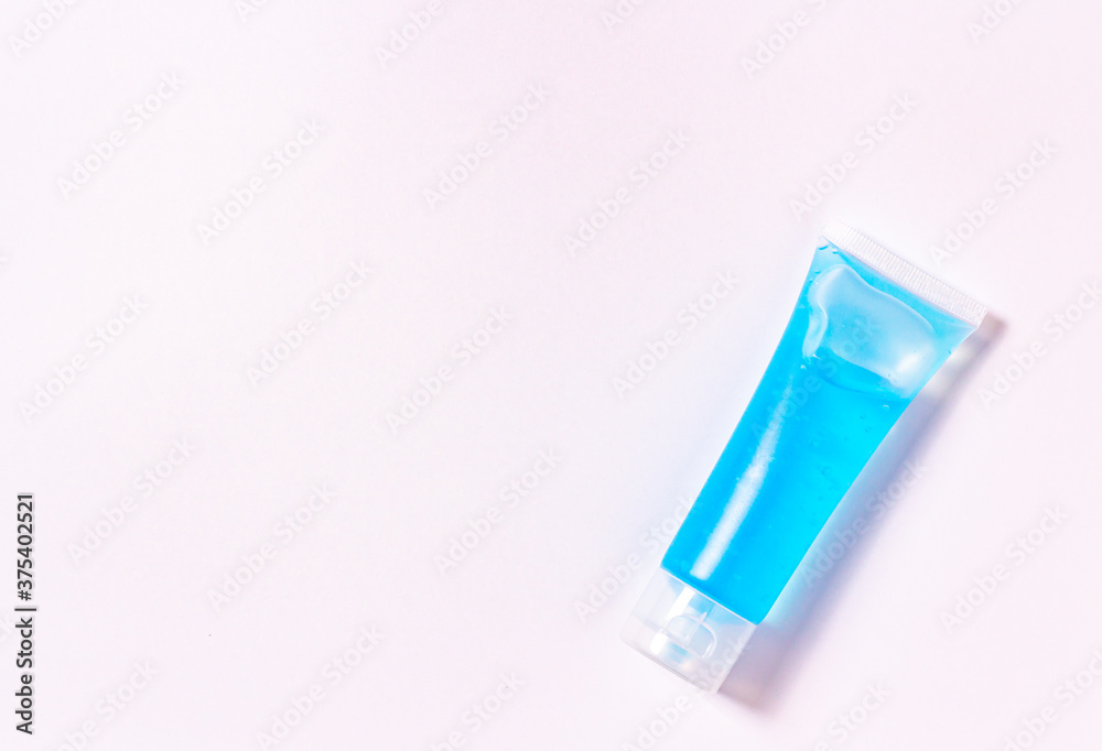 Flat lay blue alcohol gel tubes for prevention and disinfection of corona virus. Or hand wash in hospital or home for safety. Isolated style white background and copy space for text.
