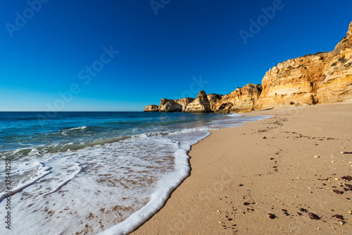 View of the scenic Marinha Beach  Praia da Marinha   with seagulls in the sand  in the Algarve region  Portugal  Concept for travel in Portugal and summer vacations.