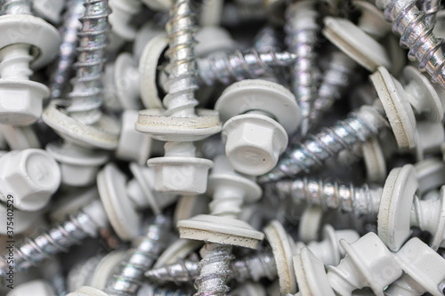 Pile of Grey roofing screws in a hardware store photo