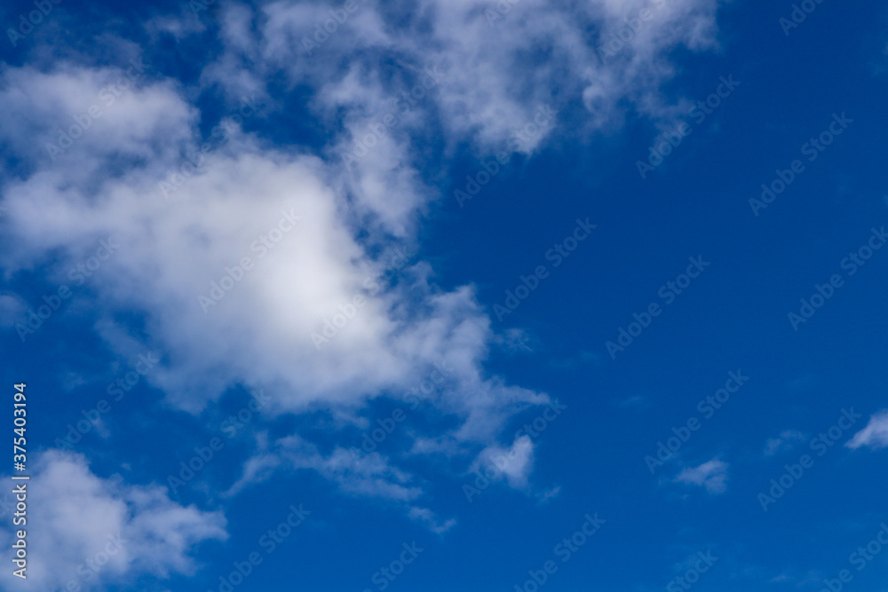 Beautiful dark blue sky with white snowy clouds Beautiful dark blue sky with white snowy clouds