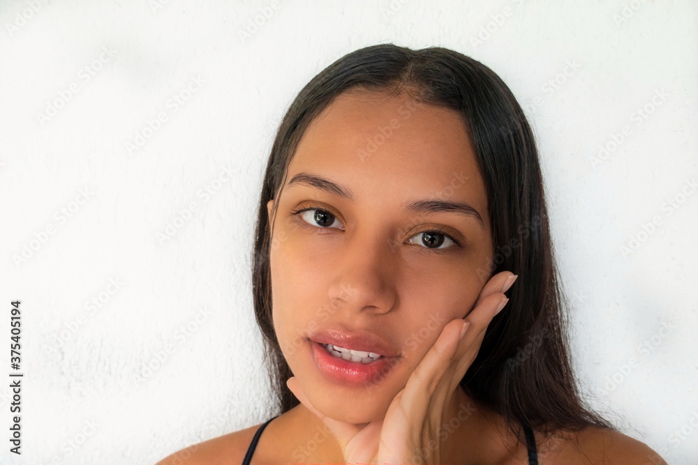 Beautiful woman touching the face with her hand. Beautiful woman touching the face with her hand.