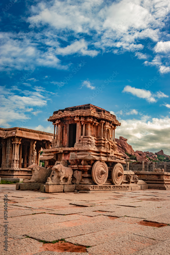 hampi stone chariot the antique stone art piece with amazing blue sky at vithala temple
