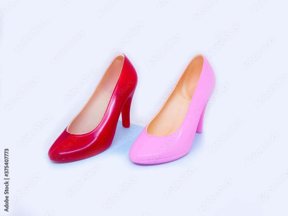 The shoes are made of dark chocolate on white background The shoes are made of dark chocolate on white background