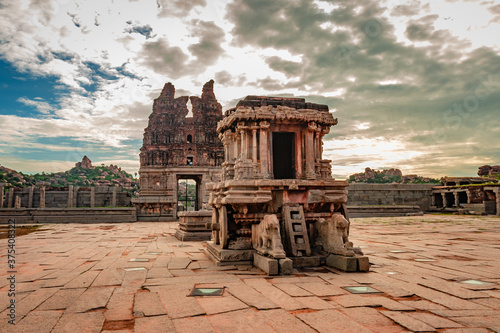 hampi stone chariot the antique stone art piece from unique angle with amazing sky photo