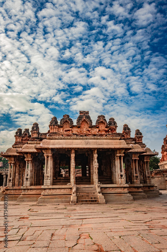 vithala temple hampi ruins antique stone art from unique angle with amazing blue sky