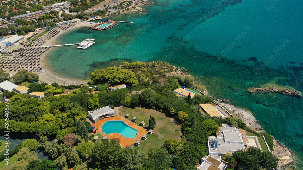 defaultAerial panoramic view of famous Grand Resort Lagonisi or Lagonissi paradise peninsula and beach with pool facilities in exotic peninsula, Athens riviera, Attica, Greece