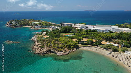 defaultAerial panoramic view of famous Grand Resort Lagonisi or Lagonissi paradise peninsula and beach with pool facilities in exotic peninsula, Athens riviera, Attica, Greece © aerial-drone