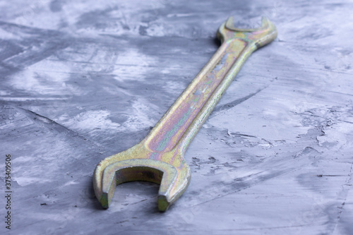 A wrench,on a colored background