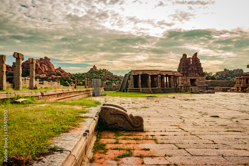 vithala temple hampi ruins antique stone art from unique angle with amazing blue sky photo