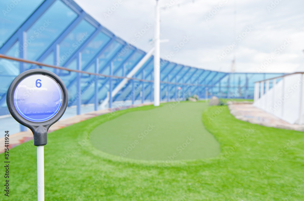 Shuffleboard and mini golf putting green field onboard luxury cruise