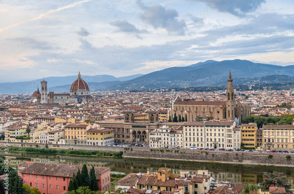 Panorama of the city of Florence, Tuscany, Italy, with a tower, houses, churches and mountains on the horizon