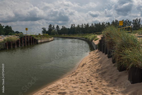Obraz na płótnie Jamienski Nurt water channel connecting the Baltic Sea with Lake Jamno near Mielno, Zachodniopomorskie, Poland w salonie