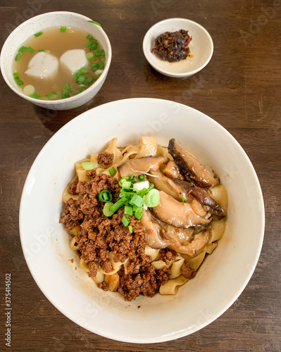 Dry Chili Bainman or Dry Chili Pan Mee from Chow Kit in Kuala Lumpur, Malaysia. Thick flat stir fried spicy noodles with Hakka cuisine roots. (ID: 375414502)