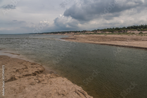 Obraz na płótnie Jamienski Nurt water channel connecting the Baltic Sea with Lake Jamno near Mielno, Zachodniopomorskie, Poland w salonie