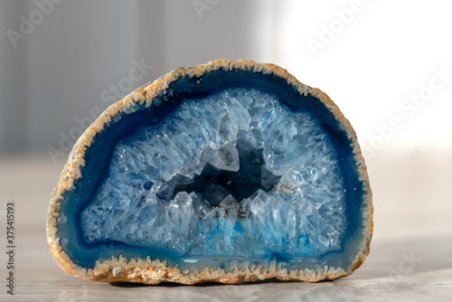 Geode with crystals of light-blue color. Quartz geode with transparent crystals. . photo