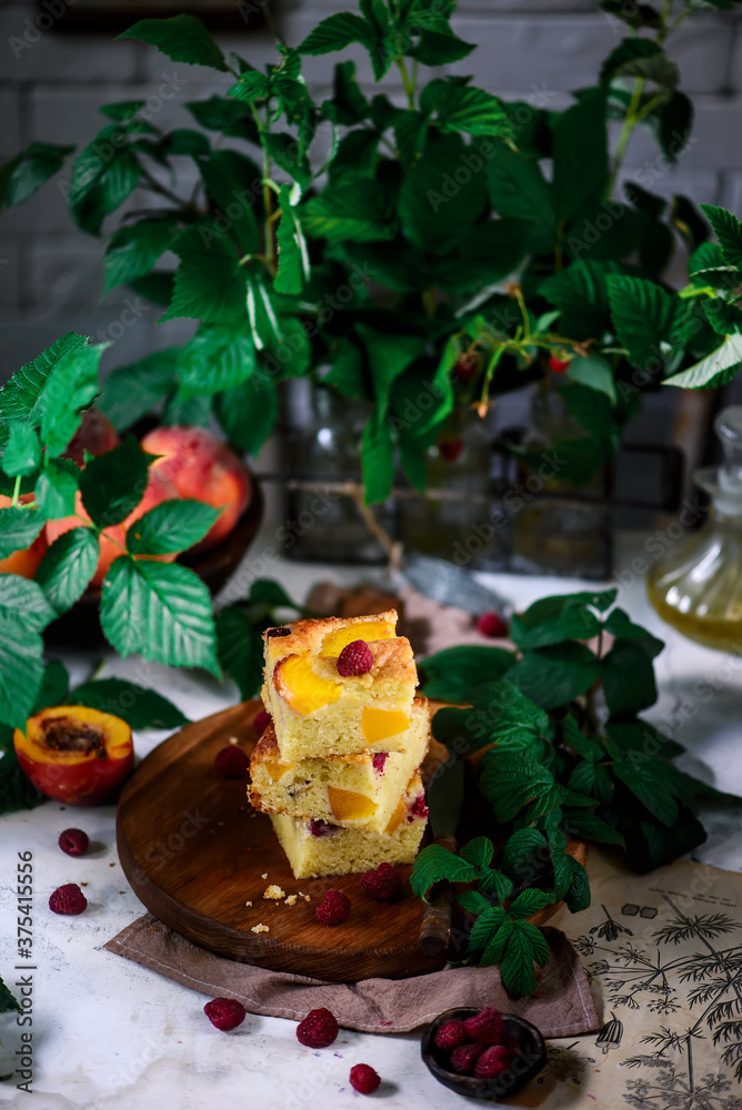 Peach raspberry olive oil cake. rustic photo