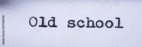 Old school written with a vintage typewriter. Panoramic image