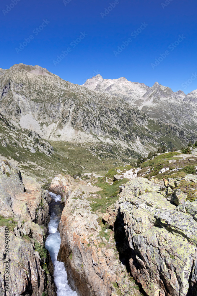 Steep canyon and fast river in mountainous landscape of French Pyrenees, France, Europe