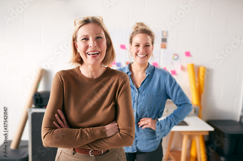 Portrait Of Two Women Running Creative Business In Studio Together
