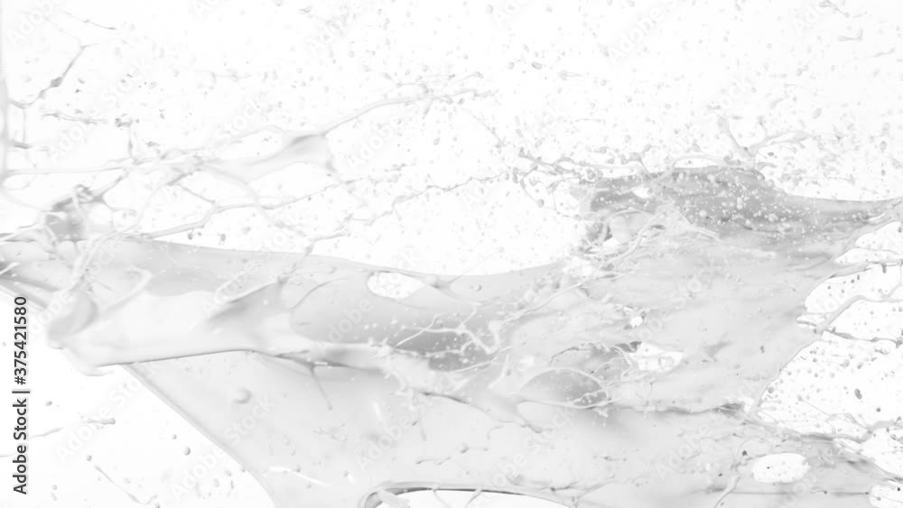 Super slow motion of flying milk splashes on white background. Filmed on high speed cinema camera, 1000 fps.