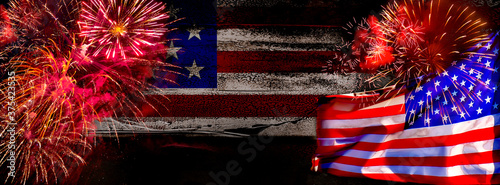 American Celebration - Us Flags and Fireworks on dark background with place for text. Indepedence Day USA photo