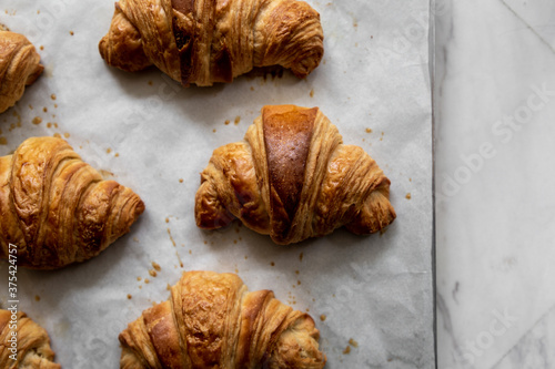 Baked butter croissants on a baking tray 