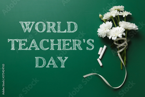 Text World Teacher's Day, chalk and bouquet on greenboard, top view. Greeting card design