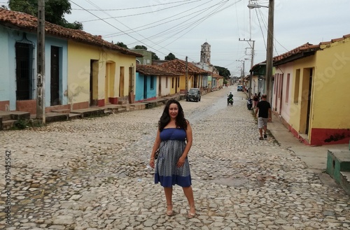Sticker woman walking in Trinidad, Cuba