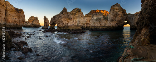 Panoramic view of the beautiful rock formations at the Ponta da Piedade, near the city of Lagos, Algarve, at sunset; Concept for travel in Portugal