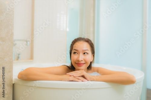 Portrait beautiful young asian woman relax smile in bathtub