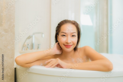 Portrait beautiful young asian woman relax smile in bathtub