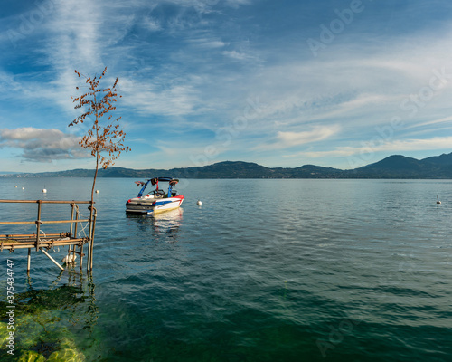 A boat on the crystal clear lake Geneva, Swiss part 