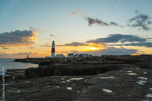 Portland Bill Lighthouse and boat houses in Dorset